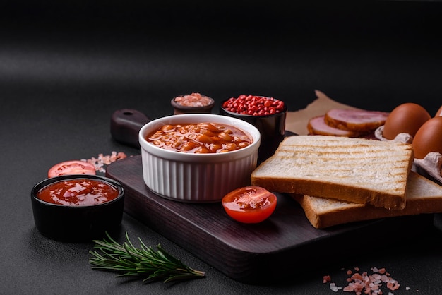 Delicious canned beans in a tomato in a white ceramic bowl