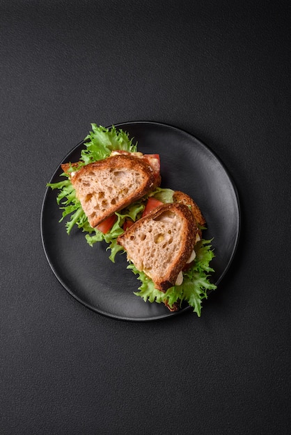 Delicious caprese sandwich with grilled toast mozzarella lettuce and tomatoes