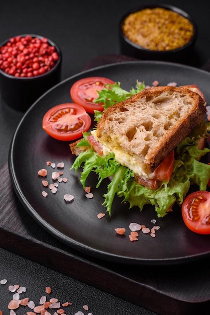 Delicious caprese sandwich with grilled toast mozzarella lettuce and tomatoes