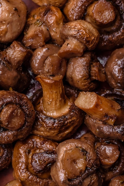 Delicious champignon mushrooms with salt spices and herbs