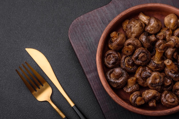 Delicious champignon mushrooms with salt spices and herbs