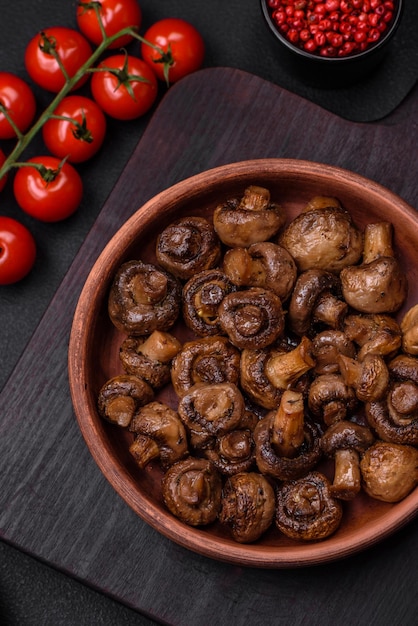 Delicious champignon mushrooms with salt spices and herbs