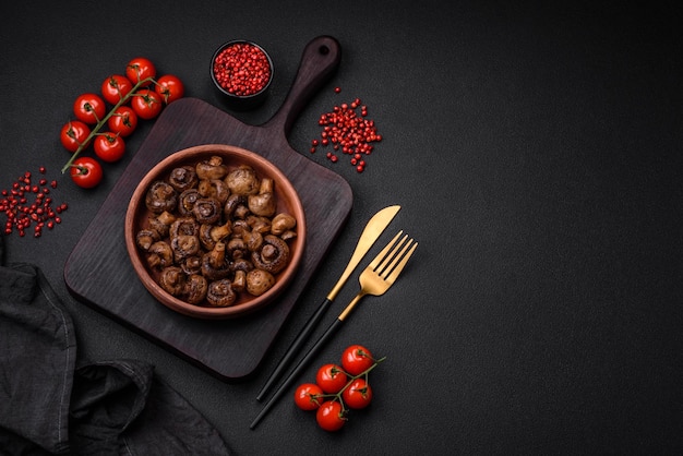 Delicious champignon mushrooms with salt spices and herbs