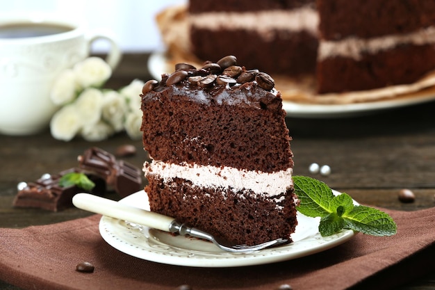 Delicious chocolate cake on table closeup