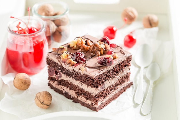 Delicious chocolate cake with cherry and nuts