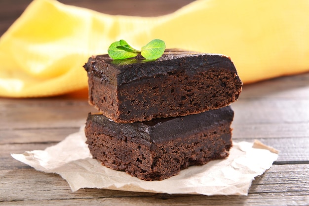 Delicious chocolate cakes on table closeup