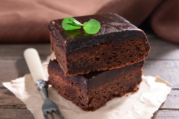 Delicious chocolate cakes on table closeup