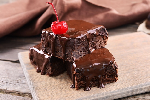 Delicious chocolate cakes on table closeup