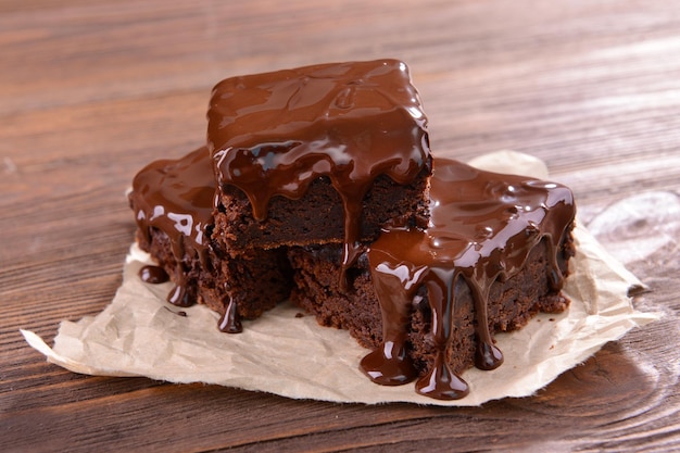 Delicious chocolate cakes on table closeup