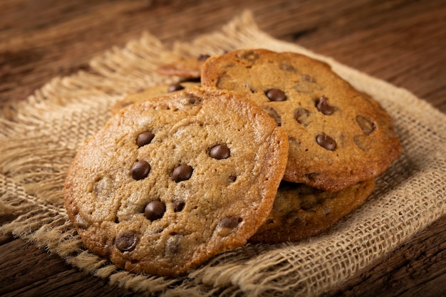 Delicious chocolate cookies on wooden table