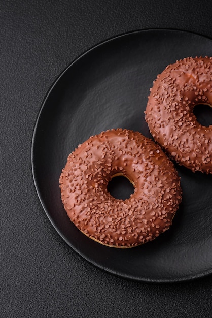 Delicious chocolate glazed donut sprinkled with chocolate chips