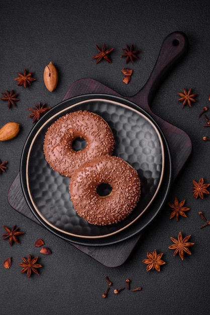 Delicious chocolate glazed donut sprinkled with chocolate chips