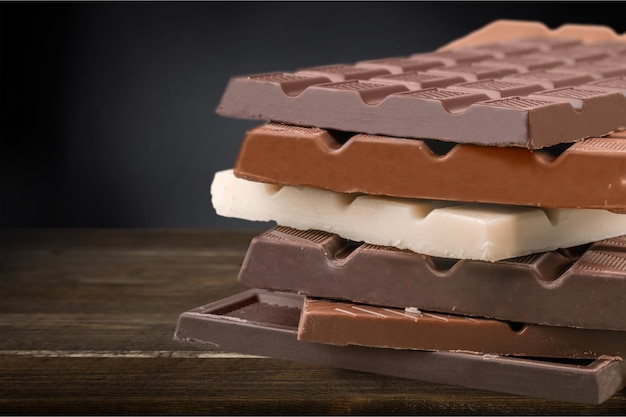 Delicious chocolates isolated on  background