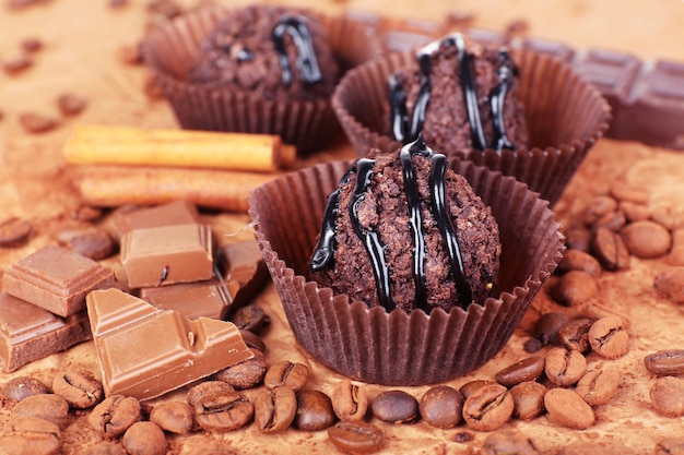 Delicious chocolates on table close-up