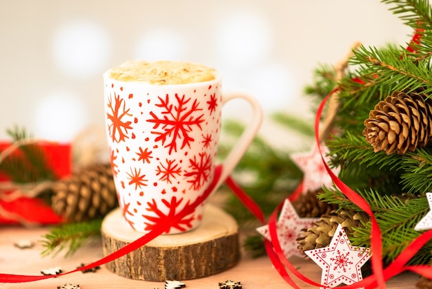 Delicious Christmas coffee. And fir branches with cones.