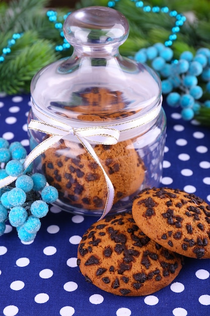 Delicious Christmas cookies in jar on table close-up