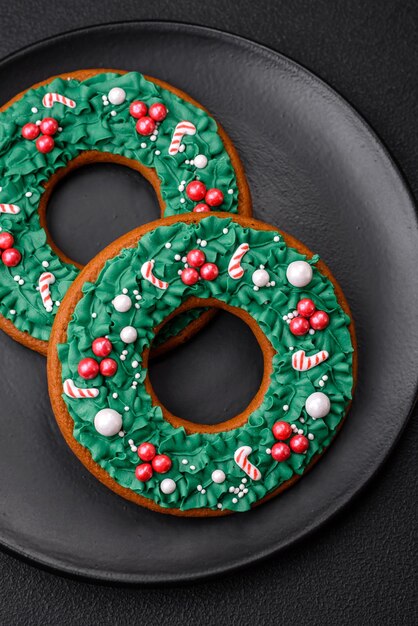 Delicious Christmas gingerbread on a dark textural background Preparing to celebrate Christmas and New Year