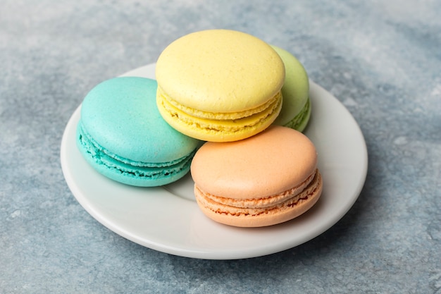 Delicious colorful cookies macarons on the plate