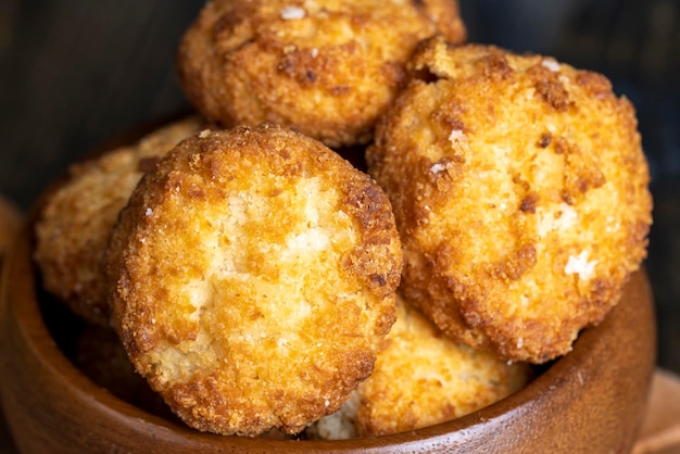 Delicious cookies with coconut on the table