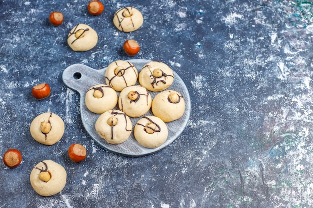 Delicious cookies with hazelnuts, top view