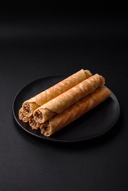 Delicious crispy wafer rolls with cream filling with nuts