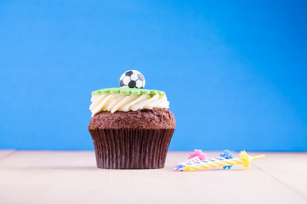 Delicious cupcake on table