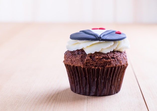 Delicious cupcake on table