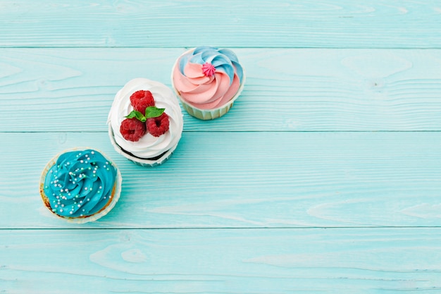 Delicious cupcakes on a colored background. Festive background, birthday