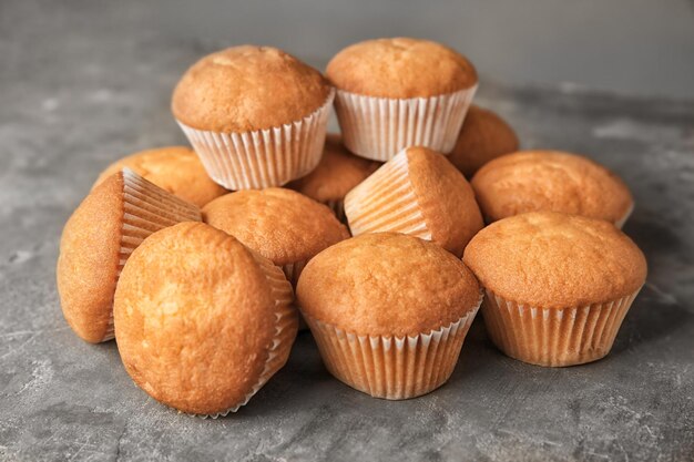 Delicious cupcakes on grey background