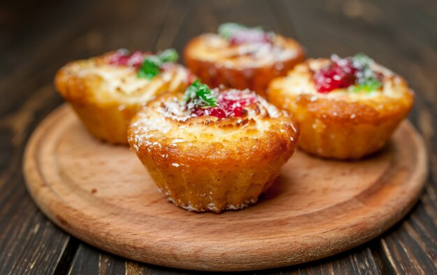 delicious cupcakes on wood background