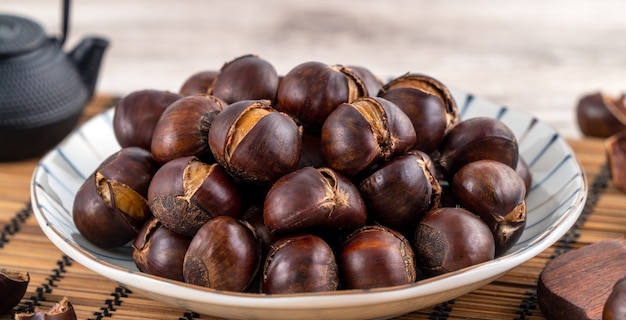 Delicious cut roasted chestnuts with oil and sugar