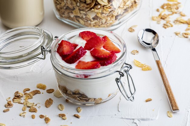 Delicious dessert of strawberries, yogurt and sugar-free cereals..