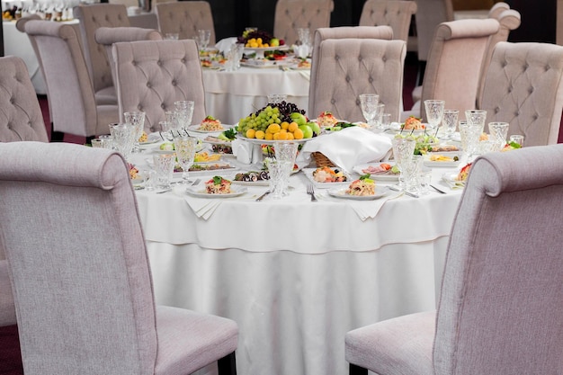 Delicious dishes on the festive table in the restaurant Serving table