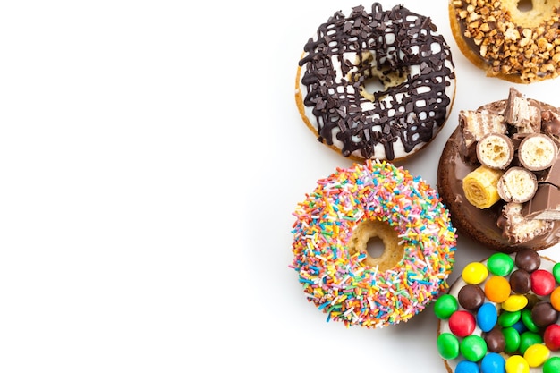 Delicious donuts with icing isolated on white