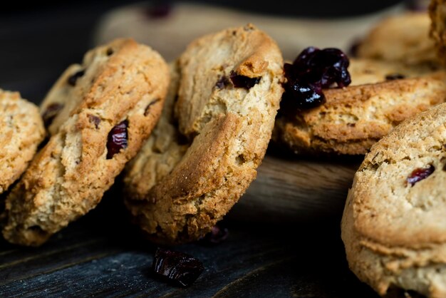 Delicious dried cookies made of highquality flour with dried red cranberries on the table