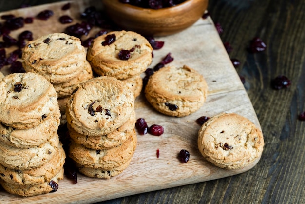 Delicious dried cookies made of highquality flour with dried red cranberries on the table