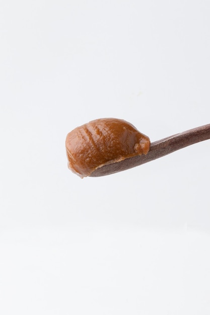 Delicious dulce de leche on spoon