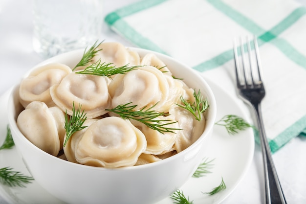 Delicious Dumplings and dill in a bowl