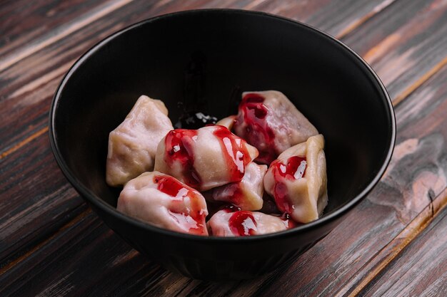 Delicious dumplings with cherries and jam