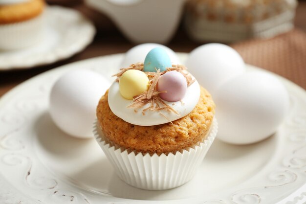 Delicious Easter cupcake on white plate