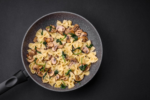 Delicious farfalle pasta with mushrooms cheese and spinach with spices