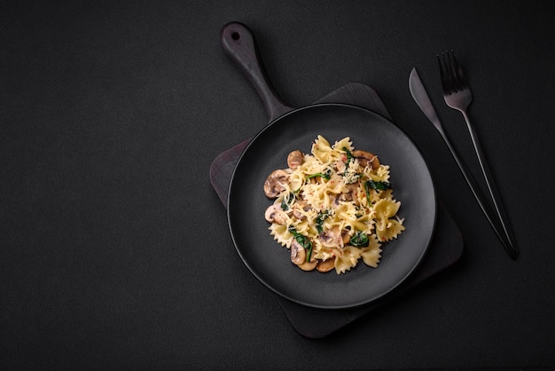 Delicious farfalle pasta with mushrooms cheese and spinach with spices