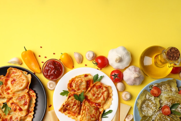 Delicious food concept with ravioli on yellow background