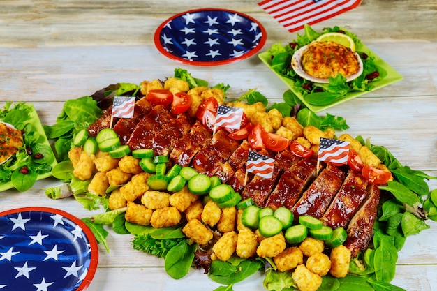 Delicious food on party table with american pattern plates.