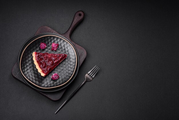 Delicious fragrant sweet pie with cherry berries on a ceramic plate