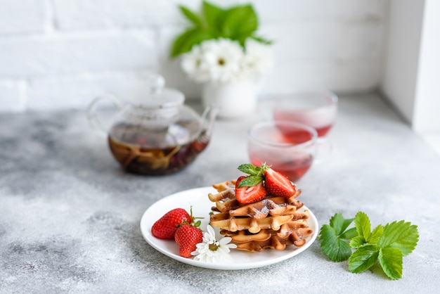 Delicious fresh baked belgian waffles with berries and fruit