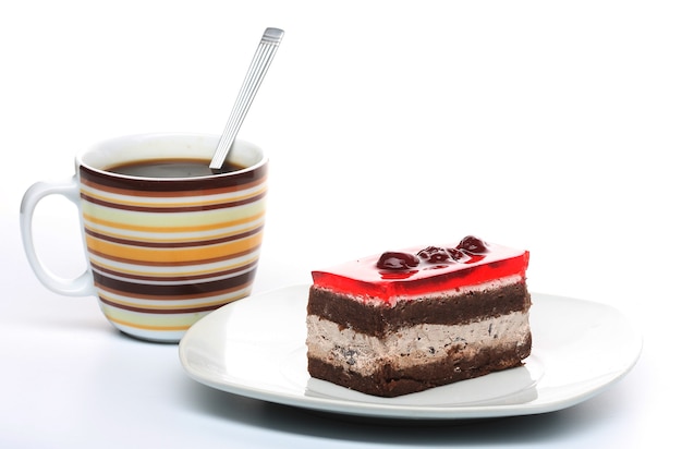 Delicious fresh baked chocolate cake with a cup of coffee