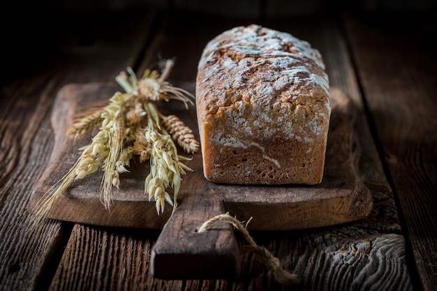 Delicious and fresh bread with several grains on wooden table