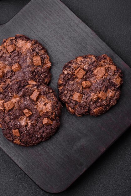 Delicious fresh crispy oatmeal cookies with chocolate and nuts