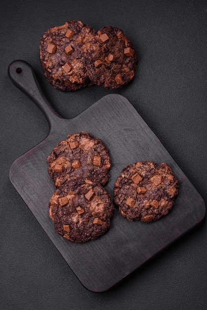 Delicious fresh crispy oatmeal cookies with chocolate and nuts